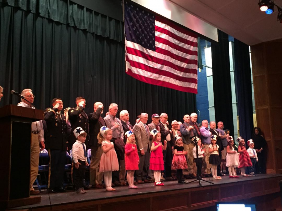 Veterans and students from The Gingerbread House lead SRHS in the flag salute